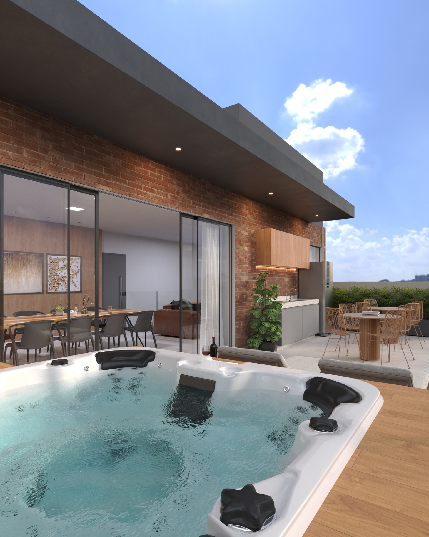 Terraço da cobertura com spa, área gourmet e tijolinho aparente